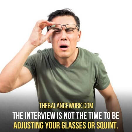 Adjusting your glasses or squint.